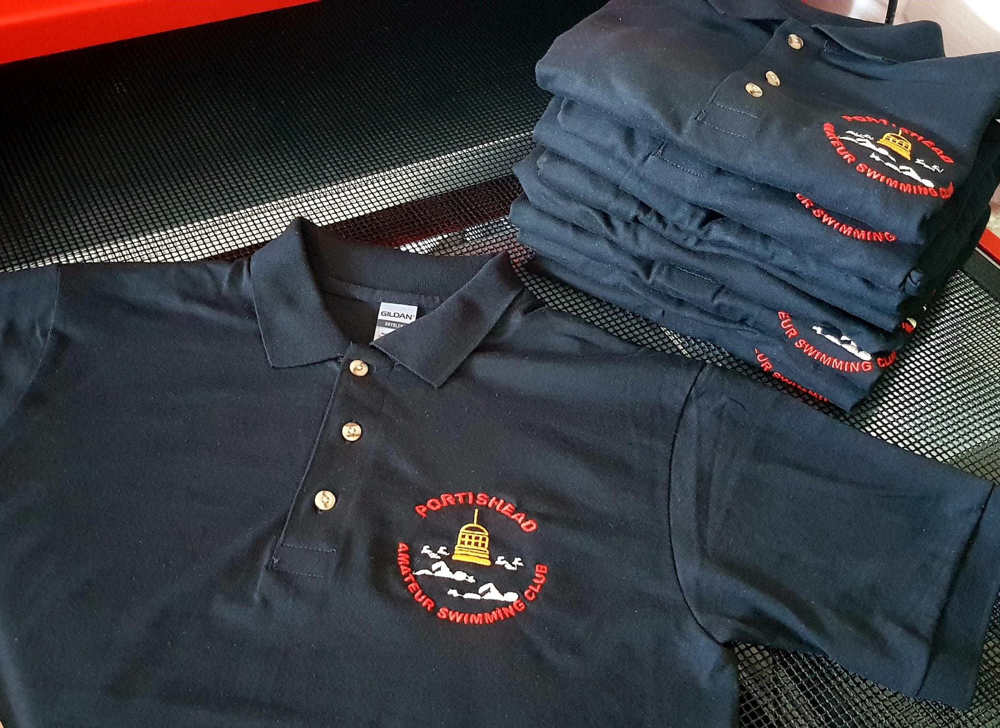 Branded polo shirts Kenya with embroidered logos for corporate uniforms and team wear